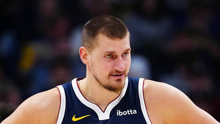 Dec 15, 2025; Denver, Colorado, USA; Denver Nuggets center Nikola Jokic (15) reacts in the second quarter against the Houston Rockets at Ball Arena. Mandatory Credit: Ron Chenoy-Imagn Images