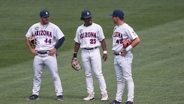 Jun 21, 2021; Omaha, Nebraska, USA;  Arizona Wildcats outfielder Tanner O'Tremba (44) and outfielder Donta Williams (23) and outfielder Ryan Holgate (42) during a break in the seventh inning against the Stanford Cardinal at TD Ameritrade Park. Mandatory Credit: Steven Branscombe-Imagn Images