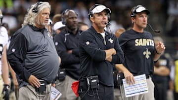 Aug 22, 2015; New Orleans Saints head coach Sean Payton, center, with defensive coaches Rob Ryan and Dennis Allen