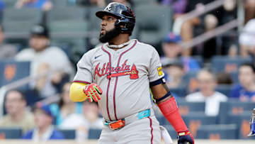 Atlanta Braves designated hitter Marcell Ozuna hits a home run against the New York Mets.