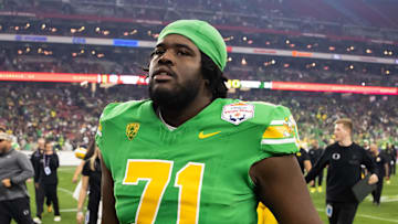 Jan 1, 2024; Glendale, AZ, USA; Oregon Ducks offensive lineman George Silva (71) against the Liberty Flames during the 2024 Fiesta Bowl at State Farm Stadium. Mandatory Credit: Mark J. Rebilas-Imagn Images