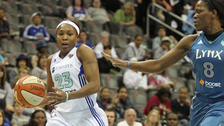 May 22, 2012; Newark, NJ, USA; New York Liberty guard Cappie Pondexter (23) drives past Minnesota Lynx defender Taj McWilliams-Franklin (8) during the first quarter of a WNBA game at the Prudential Center. Mandatory Credit: Brad Penner-Imagn Images