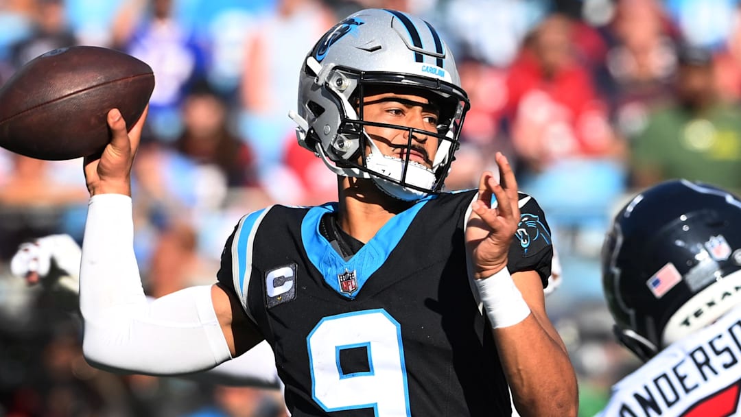 Oct 29, 2023; Charlotte, North Carolina, USA; Carolina Panthers quarterback Bryce Young (9) passes the ball as Houston Texans defensive end Will Anderson Jr. (51) pressures in the fourth quarter at Bank of America Stadium. Mandatory Credit: Bob Donnan-Imagn Images