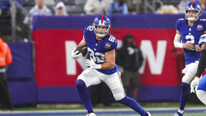 Aug 8, 2024; East Rutherford, New Jersey, USA;  New York Giants tight end Daniel Bellinger (82) runs after a catch against the Detroit Lions at MetLife Stadium.  