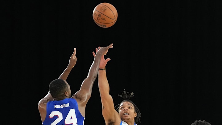 Dec 22, 2021; Las Vegas, NV, USA; Oklahoma City Blue guard Rob Edwards (25) defends against a shot by Delaware Blue Coats guard Jared Brownridge (24) during the second quarter at Mandalay Bay Convention Center. Mandatory Credit: Stephen R. Sylvanie-Imagn Images