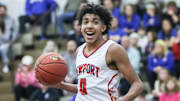 Newport's Taylen Kinney (0) reacts after scoring two of his 13 points 
