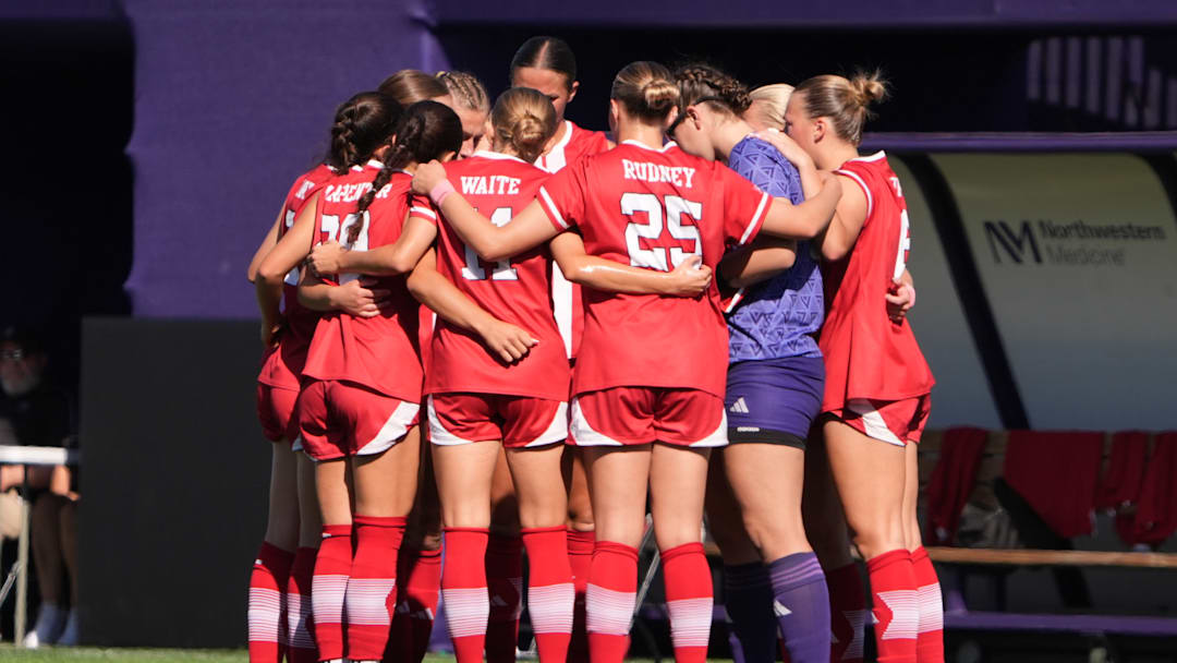 Nebraska players huddle at Northwestern.