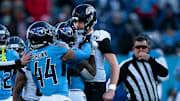 Tennessee running back Julius Chestnut (36), center, and Jacksonville punter Logan Cooke (9) get into a skirmish after a Jacksonville punt in the fourth quarter of their game at Nissan Stadium Sunday, Nov. 30, 2025.
