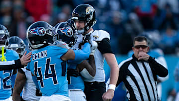 Tennessee running back Julius Chestnut (36), center, and Jacksonville punter Logan Cooke (9) get into a skirmish after a Jacksonville punt in the fourth quarter of their game at Nissan Stadium Sunday, Nov. 30, 2025.