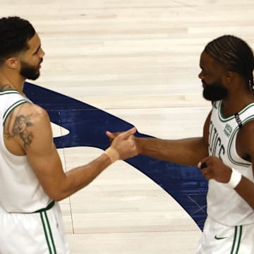 Jun 12, 2024; Dallas, Texas, USA; Boston Celtics forward Jayson Tatum (0) and guard Jaylen Brown (7) celebrate after defeating the Dallas Mavericks in game three of the 2024 NBA Finals at American Airlines Center. Mandatory Credit: Peter Casey-Imagn Images
