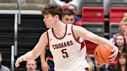 Feb 8, 2025; Pullman, Washington, USA; Washington State Cougars guard Tomas Thrastarson (5) controls the ball against the Pepperdine Waves in the first half at Friel Court at Beasley Coliseum. Mandatory Credit: James Snook-Imagn Images