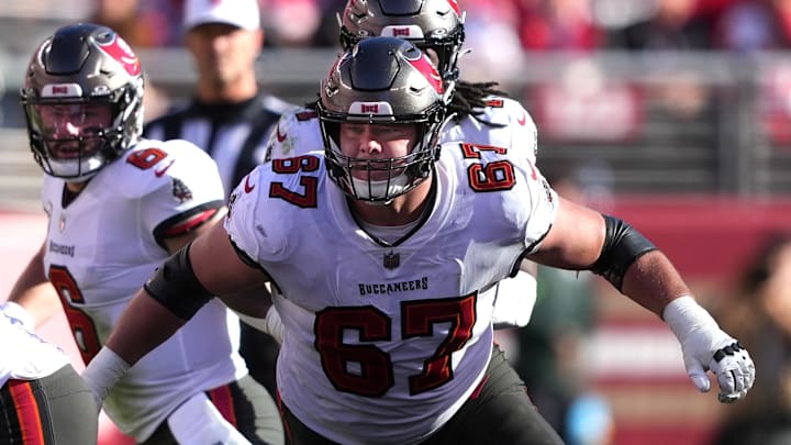 Nov 19, 2023; Santa Clara, California, USA; Tampa Bay Buccaneers offensive tackle Luke Goedeke (67) blocks against San Francisco 49ers linebacker Fred Warner (54) during the second quarter at Levi's Stadium. Mandatory Credit: Darren Yamashita-Imagn Images