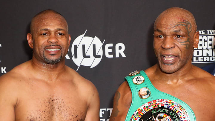Nov 28, 2020; Los Angeles, CA, USA; Mike Tyson and Roy Jones, Jr. pose with their belts after a split draw. Nov 28, 2020; Los Angeles, CA, USA; Mike Tyson and Roy Jones, Jr. pose with their belts after a split draw.