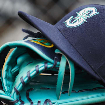 May 12, 2018; Detroit, MI, USA; Hat and glove of Seattle Mariners center fielder Dee Gordon (9) sits in dugout during the third inning against the Detroit Tigers at Comerica Park. 