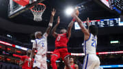 Louisville's Mike James goes in for a shot in the second half against Kentucky