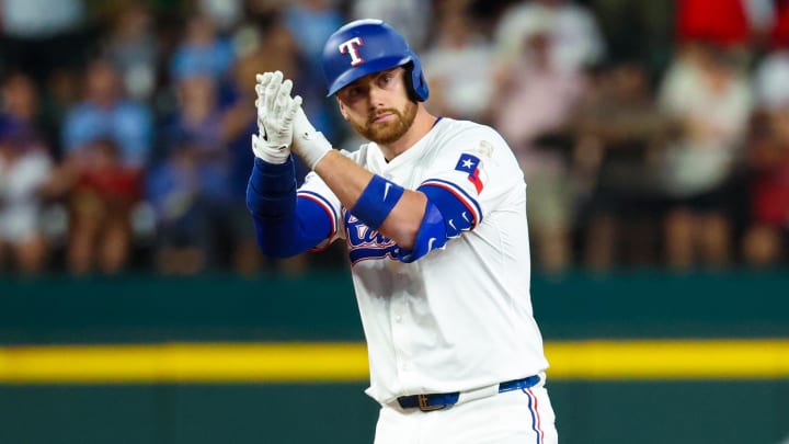 Aug 17, 2024; Arlington, Texas, USA;  Texas Rangers designated hitter Carson Kelly (18) reacts after hitting an rbi double during the fourth inning against the Minnesota Twins at Globe Life Field. 