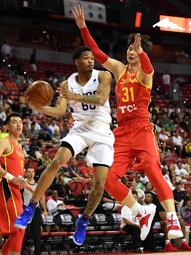 Phoenix Suns forward James Palmer Jr (60) looks to make a pass in front of a Chinese National Team center.