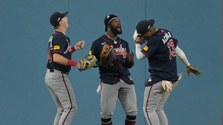 Oct 4, 2026; Los Angeles, California, USA;  Atlanta Braves outfielder Mike Yastrzemski (18), outfielder Michael Harris II (23) and outfielder Ronald Acuna Jr. (13) celebrate after defeating the Los Angeles Dodgers in game two of the NLDS for the 2026 MLB Playoffs at Uniqlo Field at Dodger Stadium.  Mandatory Credit: Jayne Kamin-Oncea-Imagn Images