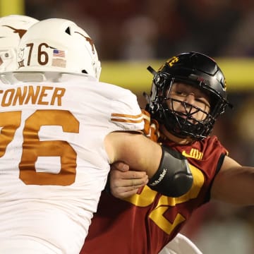 Nov 18, 2023; Ames, Iowa, USA; Iowa State Cyclones defensive end Joey Petersen (52) blocks against Texas Longhorns offensive lineman Hayden Conner (76) at Jack Trice Stadium. Mandatory Credit: Reese Strickland-USA TODAY Sports