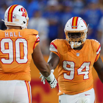 Oct 15, 2023; Tampa, Florida, USA;  Tampa Bay Buccaneers defensive end Logan Hall (90) congratulated defensive tackle Calijah Kancey (94) after a sack against the Detroit Lions in the fourth quarter at Raymond James Stadium. Mandatory Credit: Nathan Ray Seebeck-USA TODAY Sports