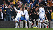 Joel Piroe scored four as Leeds drubbed Stoke to seal promotion