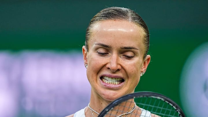 Elina Svitolina reacts to a point against Elena Rybakina