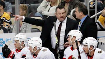 Mar 20, 2023; Pittsburgh, Pennsylvania, USA;  Ottawa Senators head coach D.J. Smith (left) talks with associate coach Jack Capuano (right) on the bench against the Pittsburgh Penguins at PPG Paints Arena. Mandatory Credit: Charles LeClaire-Imagn Images
