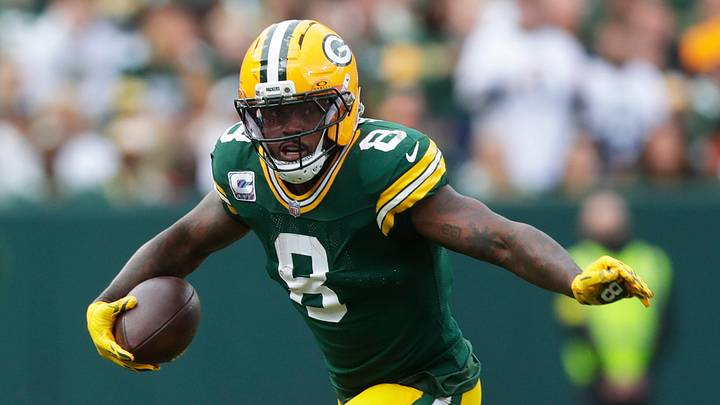 Green Bay Packers running back Josh Jacobs (8) runs the ball