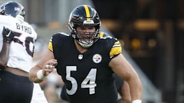 Pittsburgh Steelers center Zach Frazier (54) blocks at the line of scrimmage against the Houston Texans during the first quarter at Acrisure Stadium.
