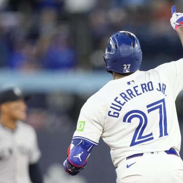 Jun 27, 2024; Toronto, Ontario, CAN; Toronto Blue Jays first baseman Vladimir Guerrero Jr. (27) celebrates his solo home run against the New York Yankees as he runs to second base during the sixth inning at Rogers Centre.