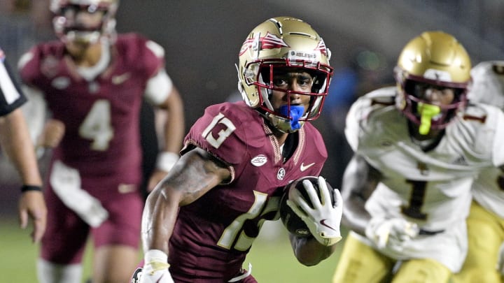 Sep 2, 2024; Tallahassee, Florida, USA; Florida State Seminoles running back Jaylin Lucas (13) runs the ball during the first half against the Boston College Eagles at Doak S. Campbell Stadium. Mandatory Credit: Melina Myers-USA TODAY Sports