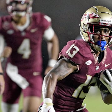 Florida State Seminoles running back Jaylin Lucas (13) runs the ball during the first half against the Boston College Eagles at Doak S. Campbell Stadium.