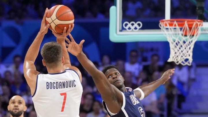 Jul 28, 2024; Villeneuve-d'Ascq, France; United States guard Anthony Edwards (5) defends a shot by Serbia shooting guard Bogdan Bogdanovic (7) in the second quarter during the Paris 2024 Olympic Summer Games at Stade Pierre-Mauroy. Mandatory Credit: John David Mercer-USA TODAY Sports