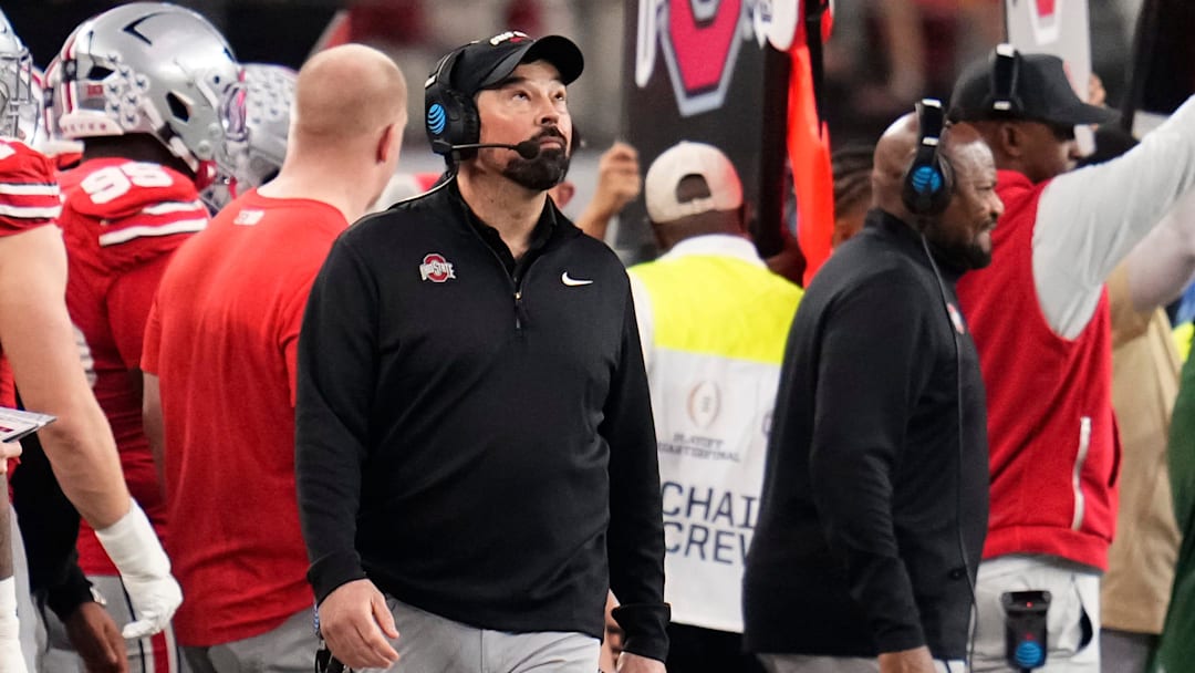 Ohio State Buckeyes head coach Ryan Day looks to the scoreboard during the Cotton Bowl at AT&T Stadium in Arlington, Texas for the College Football Playoff quarterfinal game against the Miami Hurricanes on Dec. 31, 2025.