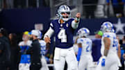 Dallas Cowboys quarterback Dak Prescott reacts after throwing a touchdown pass during the first half against the Detroit Lions 