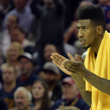 Oct 30, 2014; Cleveland, OH, USA; New York Knicks guard Iman Shumpert (21) reacts against the Cleveland Cavaliers at Quicken Loans Arena. New York won 95-90. Mandatory Credit: David Richard-Imagn Images