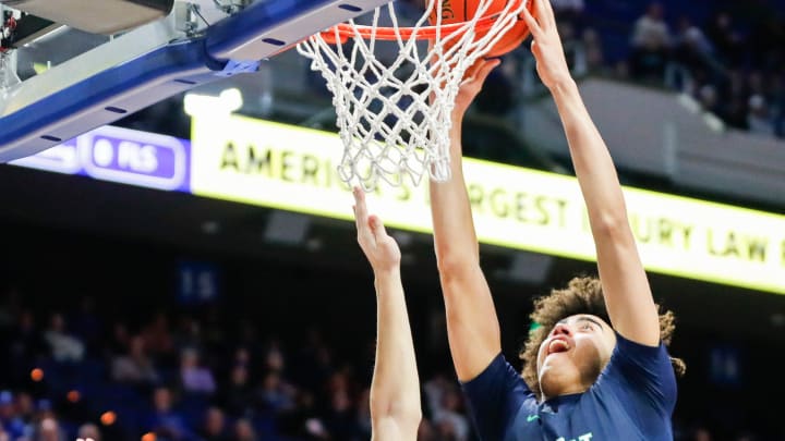 Spencer County's Keaton Baird (10) looks on as Great Crossing's Malachi Moreno (24) scores two in the first round of the 2024 UK Healthcare KHSAA Boys' Sweet 16 in Lexington. March 20, 2024