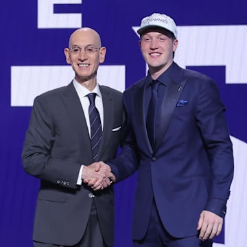 Jun 25, 2025; Brooklyn, NY, USA;  Kon Knueppel stands with NBA commissioner Adam Silver after being selected as the fourth pick by the Charlotte Hornets in the first round of the 2025 NBA Draft at Barclays Center. Mandatory Credit: Brad Penner-Imagn Images