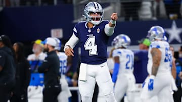 Dallas Cowboys quarterback Dak Prescott (4) reacts after throwing a touchdown pass during the first half against the Detroit Lions at AT&T Stadium.