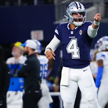 Dec 30, 2023; Arlington, Texas, USA;  Dallas Cowboys quarterback Dak Prescott (4) reacts after throwing a touchdown  pass during the first half against the Detroit Lions at AT&T Stadium.