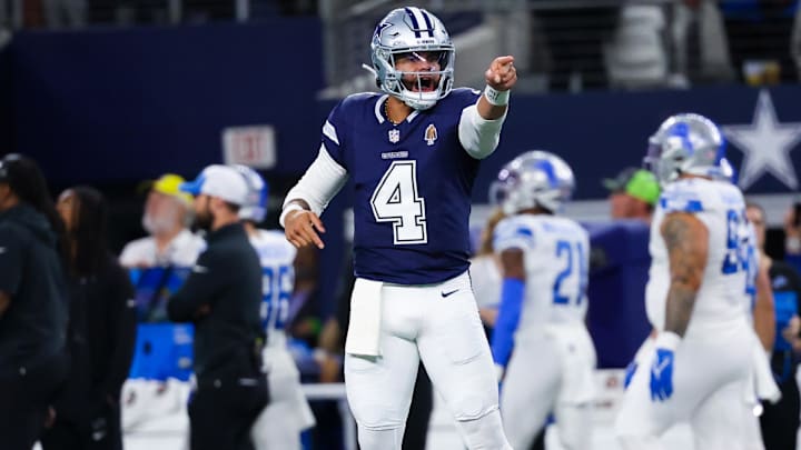 Dec 30, 2023; Arlington, Texas, USA;  Dallas Cowboys quarterback Dak Prescott (4) reacts after throwing a touchdown  pass during the first half against the Detroit Lions at AT&T Stadium.