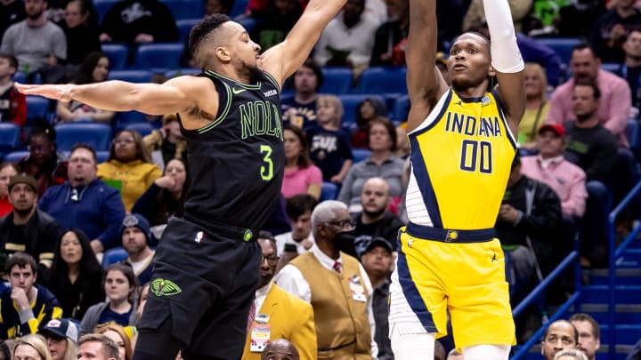 Mar 1, 2024; New Orleans, Louisiana, USA;  Indiana Pacers guard Bennedict Mathurin (00) shoots a jump shot against New Orleans Pelicans guard CJ McCollum (3) during the first half at Smoothie King Center. Mandatory Credit: Stephen Lew-USA TODAY Sports