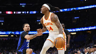 Apr 15, 2025; Orlando, Florida, USA; Atlanta Hawks guard Terance Mann (14) controls the ball against the Orlando Magic in the second quarter at Kia Center. Mandatory Credit: Nathan Ray Seebeck-Imagn Images