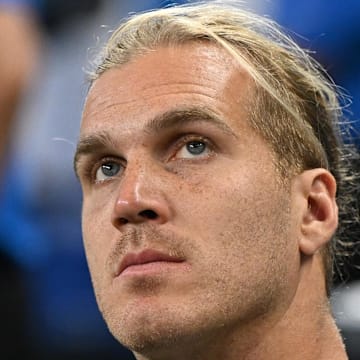 Detroit Lions linebacker Alex Anzalone (34) watches the action from the bench during preseason game against Dolphins