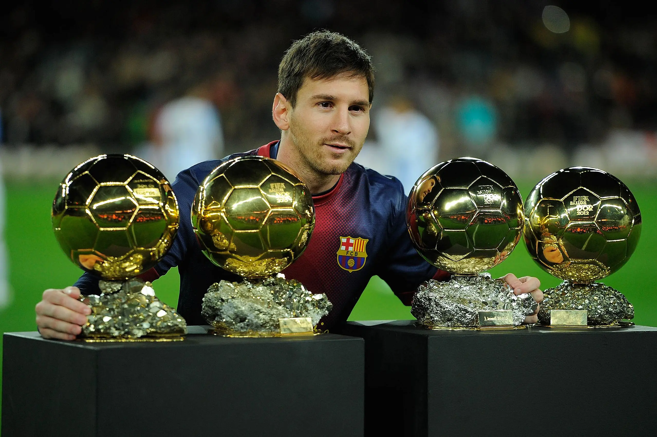 Leo Messi of Barcelona FC displays his four ballons d'or to the audience prior to the Copa del Rey Quarter Final 