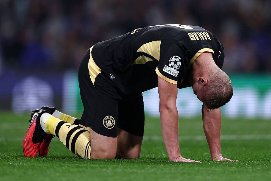 Erling Haaland on his hands and knees.