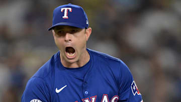 Jun 13, 2024; Los Angeles, California, USA;  Texas Rangers relief pitcher David Robertson (37) reacts after striking out Los Angeles Dodgers shortstop Mookie Betts (50), designated hitter Shohei Ohtani (17) and first baseman Freddie Freeman (5) in the eighth inning at Dodger Stadium. Mandatory Credit: Jayne Kamin-Oncea-Imagn Images