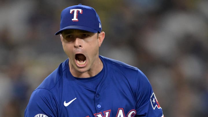 Jun 13, 2024; Los Angeles, California, USA;  Texas Rangers relief pitcher David Robertson (37) reacts after striking out Los Angeles Dodgers shortstop Mookie Betts (50), designated hitter Shohei Ohtani (17) and first baseman Freddie Freeman (5) in the eighth inning at Dodger Stadium. Mandatory Credit: Jayne Kamin-Oncea-Imagn Images