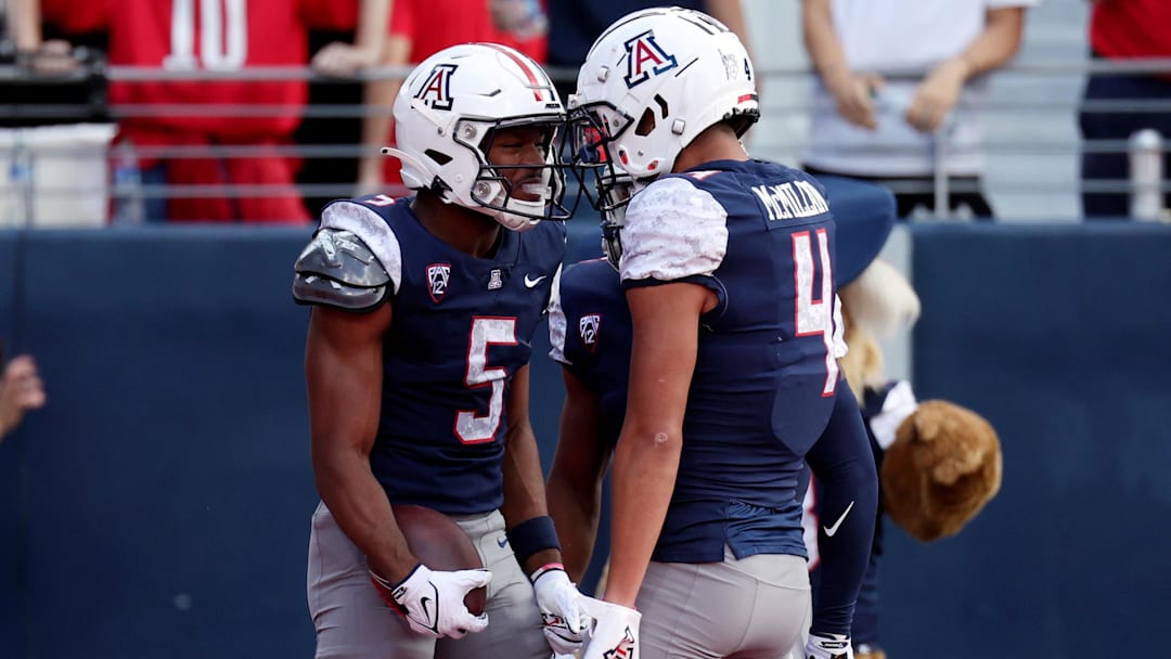 Nov 18, 2023; Tucson, Arizona, USA; Arizona Wildcats wide receiver Montana Lemonious-Craig (5) celebrates with wide receiver Tetairoa McMillan (4) after a touchdown against the Utah Utes during the first half at Arizona Stadium.