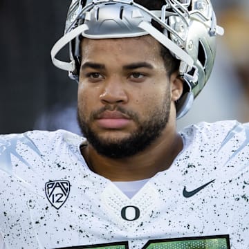 Nov 18, 2023; Tempe, Arizona, USA; Oregon Ducks offensive lineman Nishad Strother (50) against the Arizona State Sun Devils at Mountain America Stadium. Mandatory Credit: Mark J. Rebilas-Imagn Images